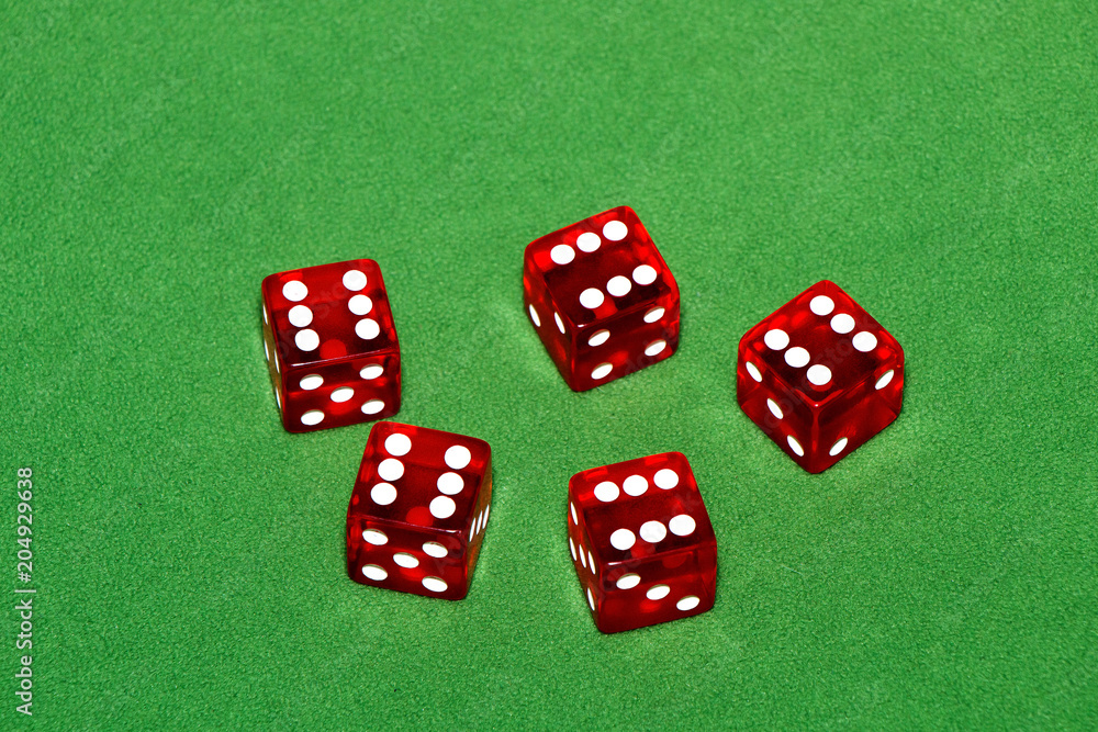 Casino. Red cubes on a green table Casino. Red cubes on a green table