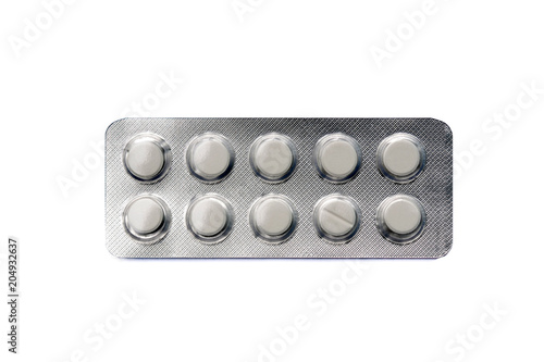 Tablets in blister package, on white background.