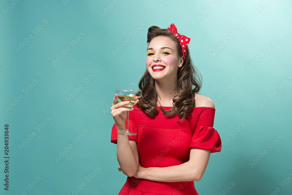 Beautiful young woman with pinup make-up and hairstyle. Studio shot on white background Beautiful young woman with pinup make-up and hairstyle. Studio shot on white background