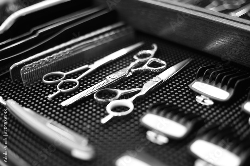 The workplace of the barber. Tools for a hairstyle. Black and white image.