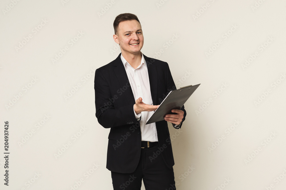 Cheerful man with notepad on white background Cheerful man with notepad on white background