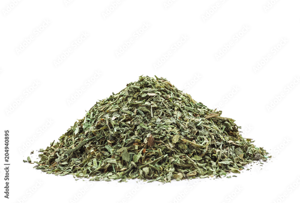 Pile of dried parsley on white background Pile of dried parsley on white background
