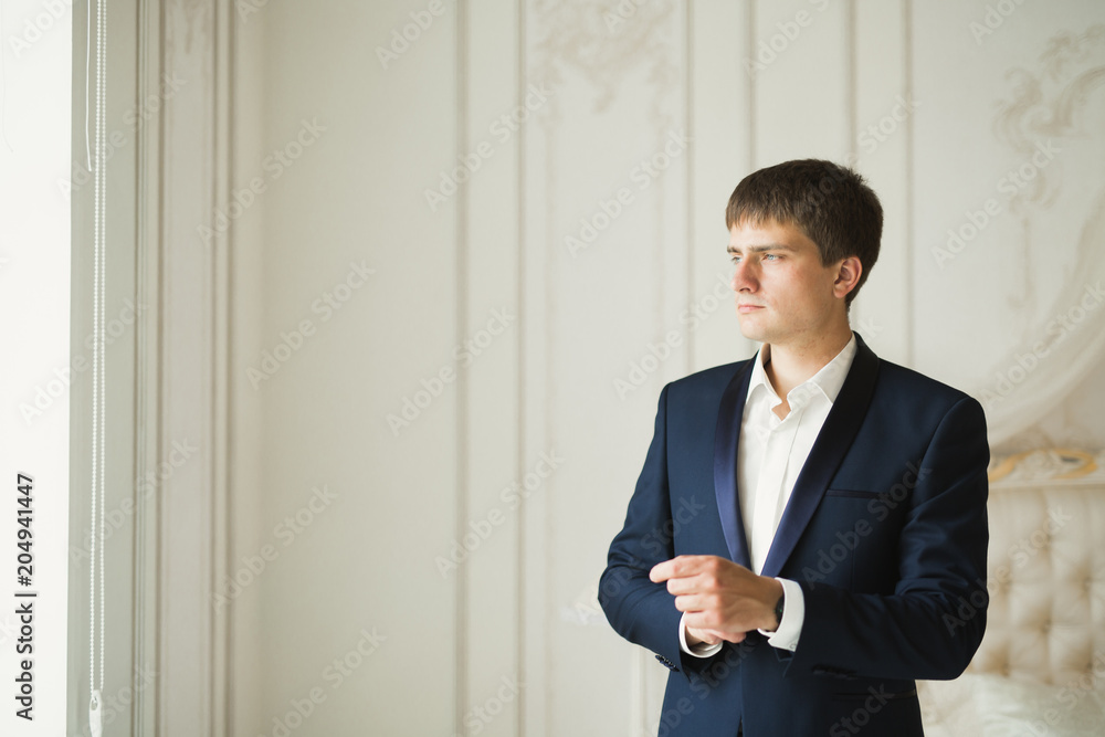 Portrait of happy businessman standing in studio Portrait of happy businessman standing in studio