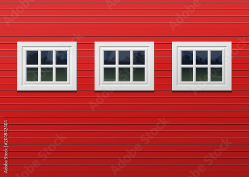 red barn facade with three windows