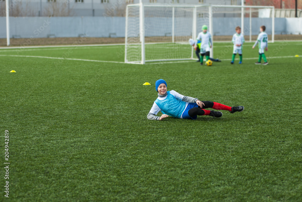 Obraz premium Happy boy football player after goal scored
