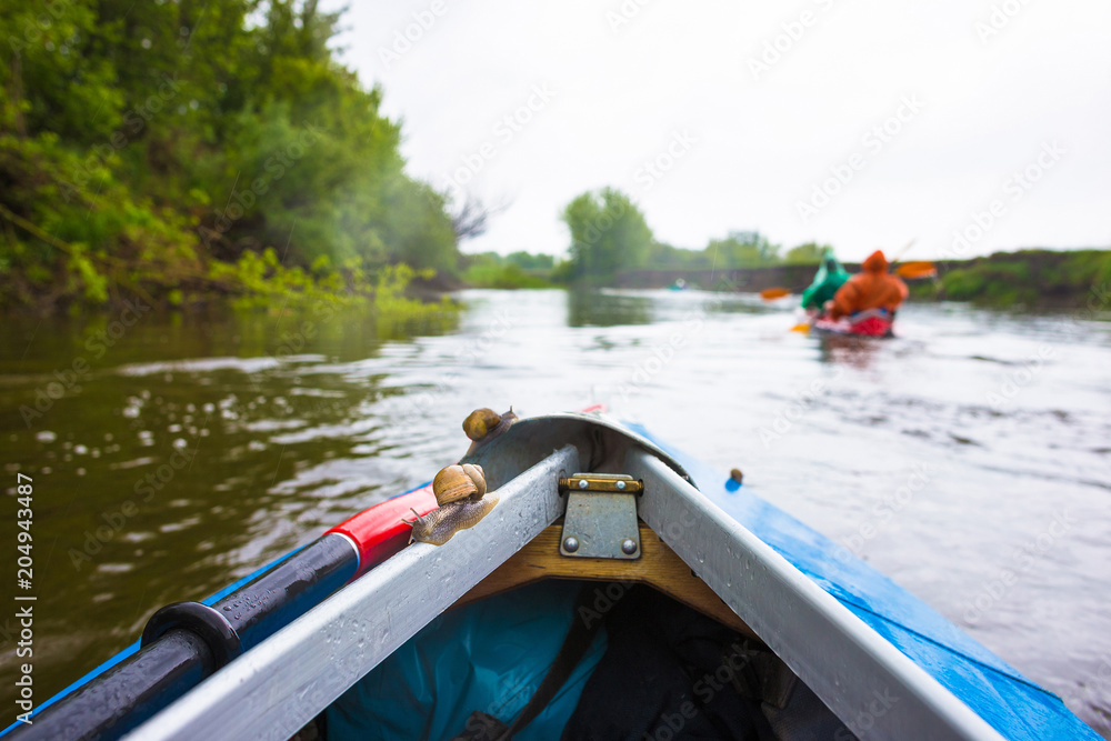Fototapeta premium Kayaking on beautiful nature at summer sunny day. Sport people having fun