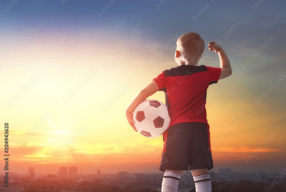 Fototapeta premium Boy playing football