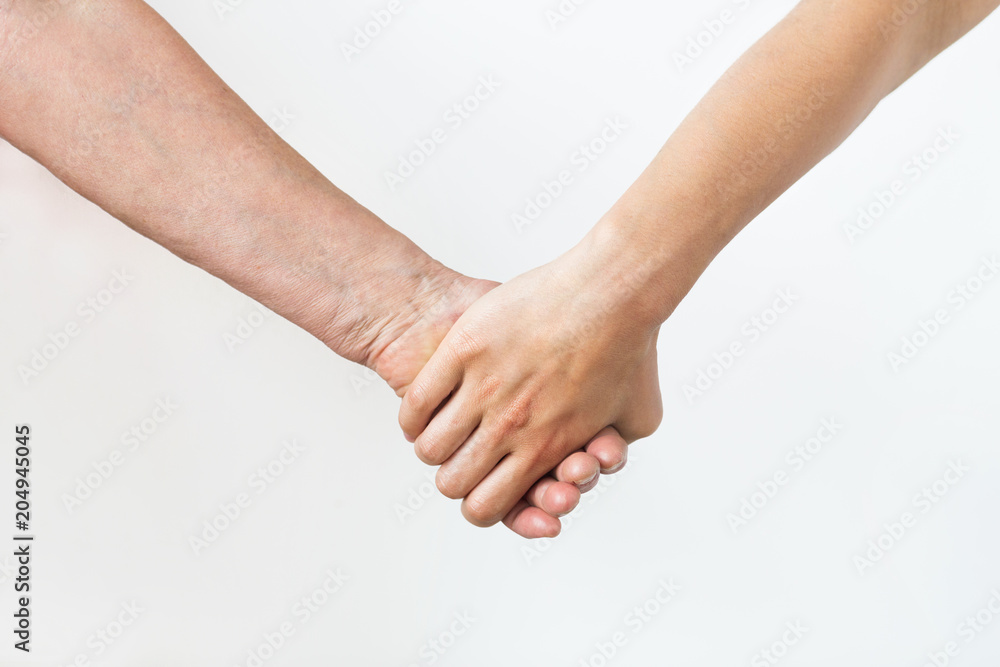 people, age and body parts concept - close up of senior and young woman holding hands people, age and body parts concept - close up of senior and young woman holding hands