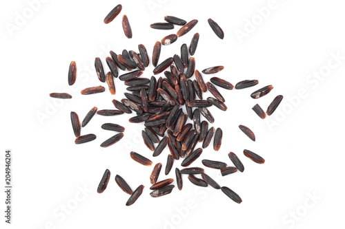 Black wild rice isolated on white background close up. Top view. Flat lay