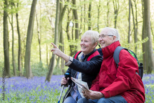 Senior Couple Resting On Walk Through Bluebell Wood © Daisy Daisy