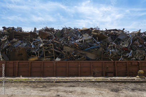 Large barge with scrap metal at the pier