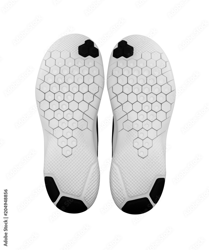 Soles of sports shoes isolated on a white. Soles of sports shoes isolated on a white.
