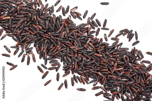 Black wild rice isolated on white background close up. Top view. Flat lay