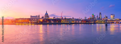 Millennium Bridge leading to Saint Paul's Cathedral in central London at sunset