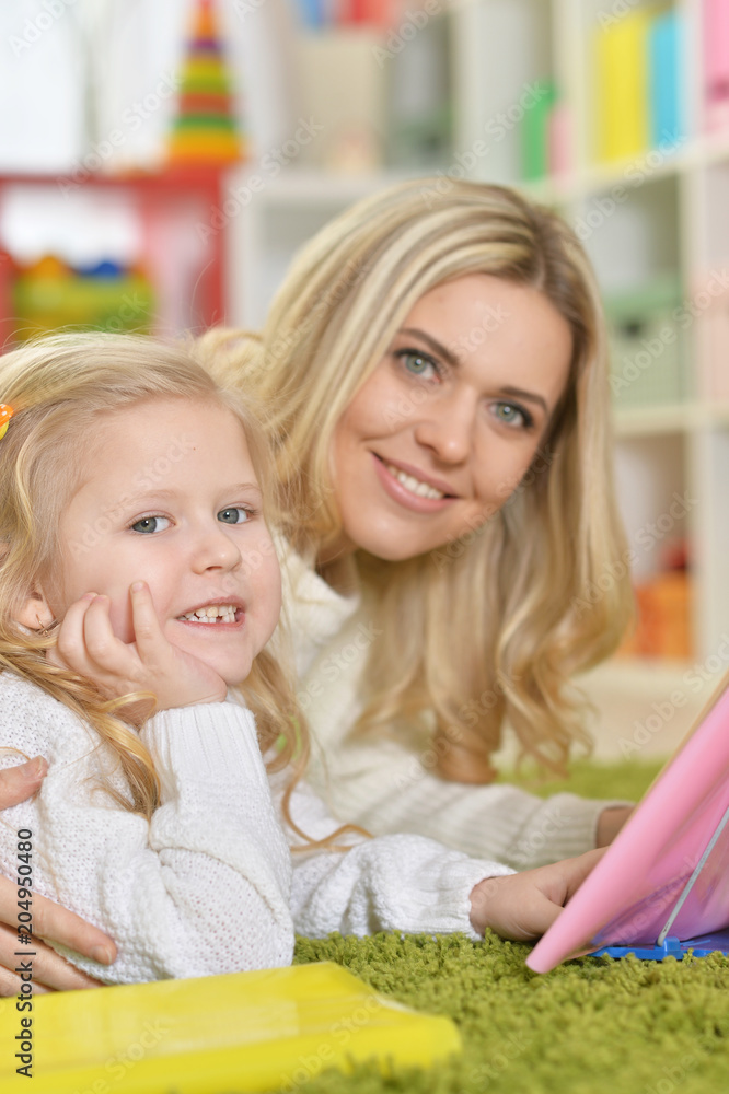 Mother with little daughter reading Mother with little daughter reading