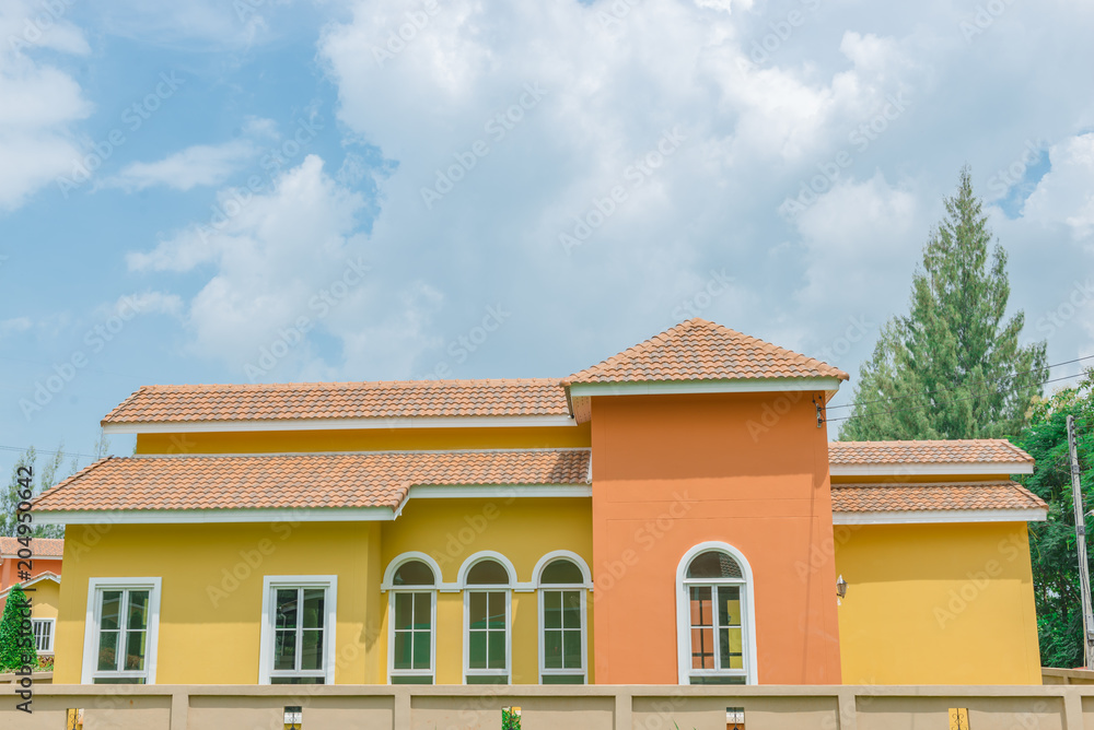 Orange home tuscany style in khaoyai resort at nakhonratchasima,vivid,sunny day,beautiful sky