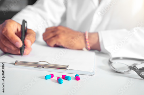 A doctor prescribe medication. prescription pills are prescribed by a doctor .