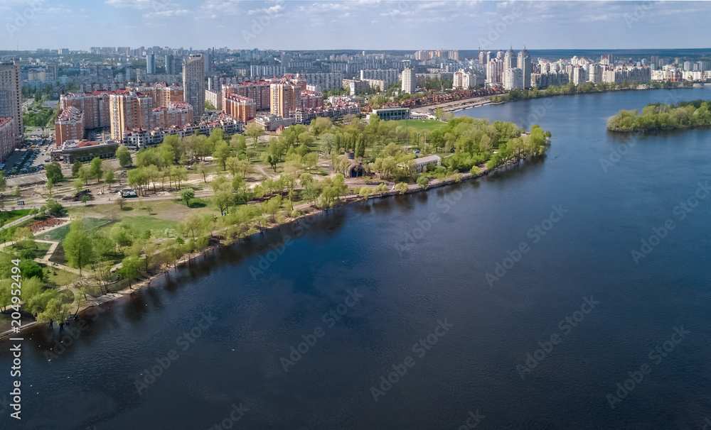 Aerial view of new modern residential Obolon district near Dnieper river in Kiev city, Kyiv cityscape from above, Ukraine
