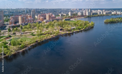 Aerial view of new modern residential Obolon district near Dnieper river in Kiev city, Kyiv cityscape from above, Ukraine 