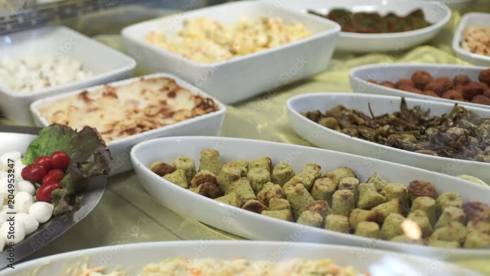 Various store made meals behind glass, close up Various store made meals behind glass, close up