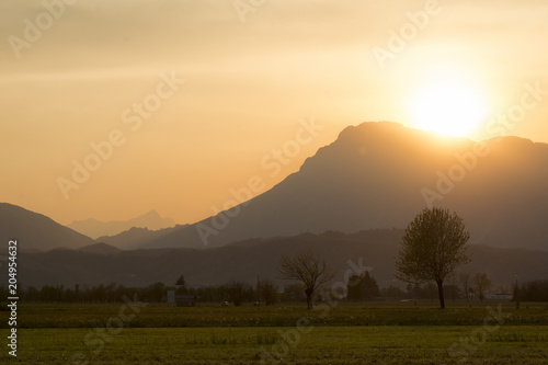 Beautiful sunset in rural area of Meduno  Italy with high mountains on the background.