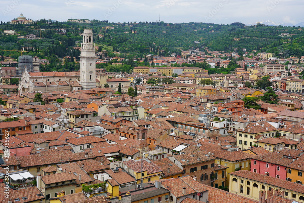 View of buildings and roofs in the old city of Verona, Italy, seen from the top of the Torre dei Lamberti tower