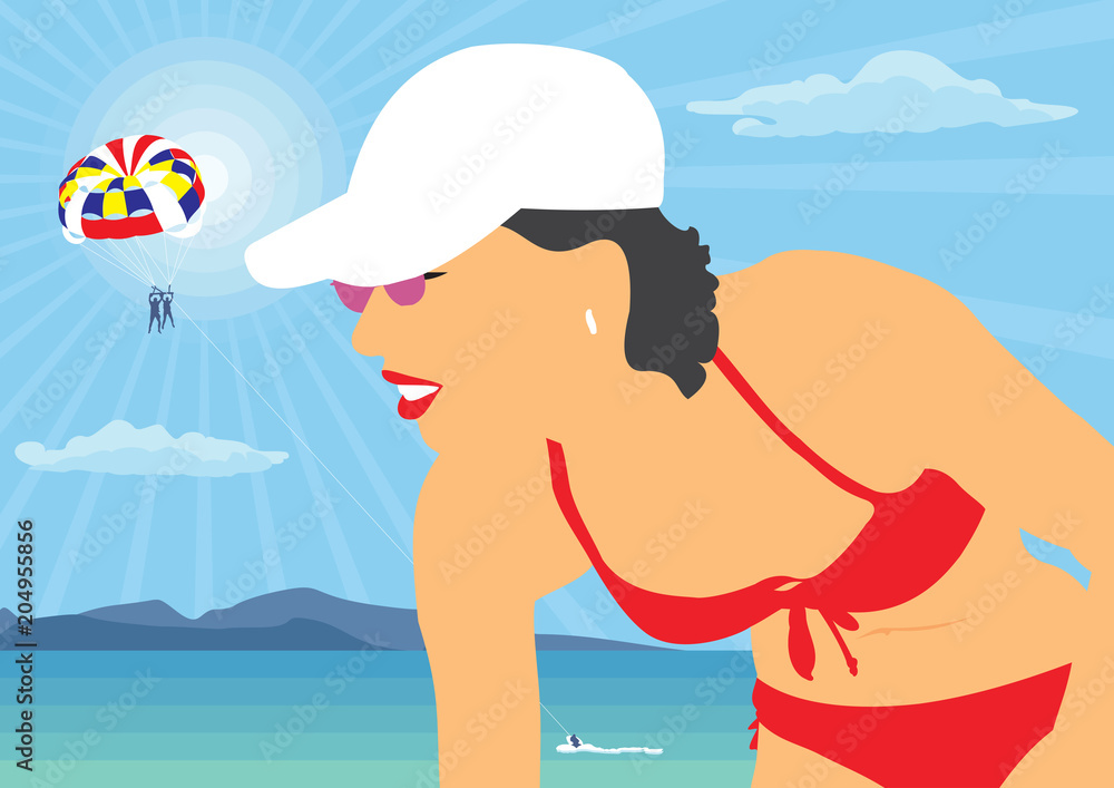 The girl in the hat by the sea. The girl in the red bathing suit on a background of the sea landscape.