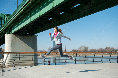 Women running on bridge