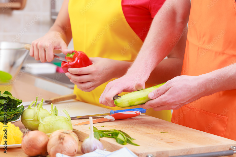 Couple preparing fresh vegetables salad. Diet Couple preparing fresh vegetables salad. Diet