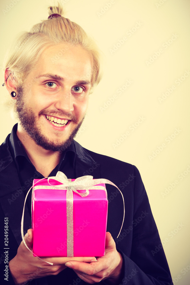 man holding present pink gift box in hand man holding present pink gift box in hand