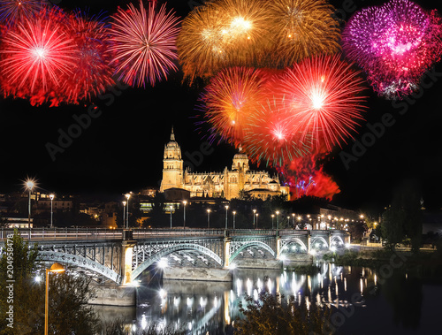 View of Fireworks over Salamanca Cathedrals from Enrique Esteban Bridge over Tormes River, Community of Castile and Leon, Spain photo