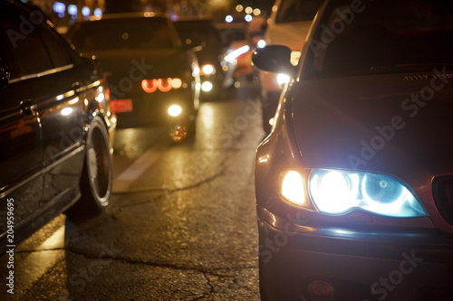 Night view of the cars. Road in the city at the night with yellow and red electrical light for cars during they are coming home. The cars compete at night. Only the lights of night carriages. © adilcelebiyev