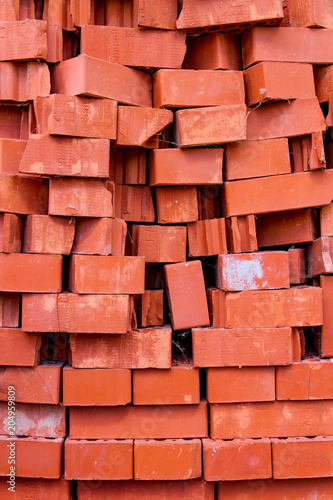 Heap of red bricks. Background red brick texture