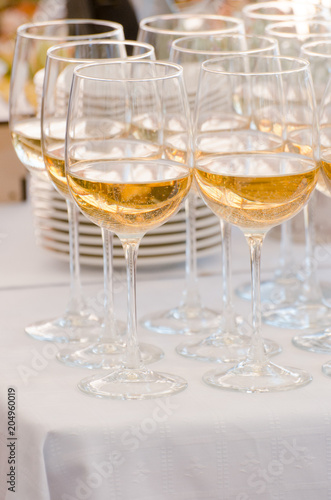 Champagne glasses being served on a party