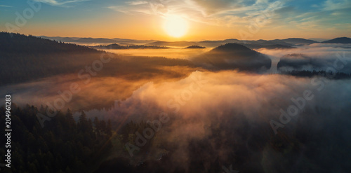 Aerial view of morning fog on the lake  sunrise shot