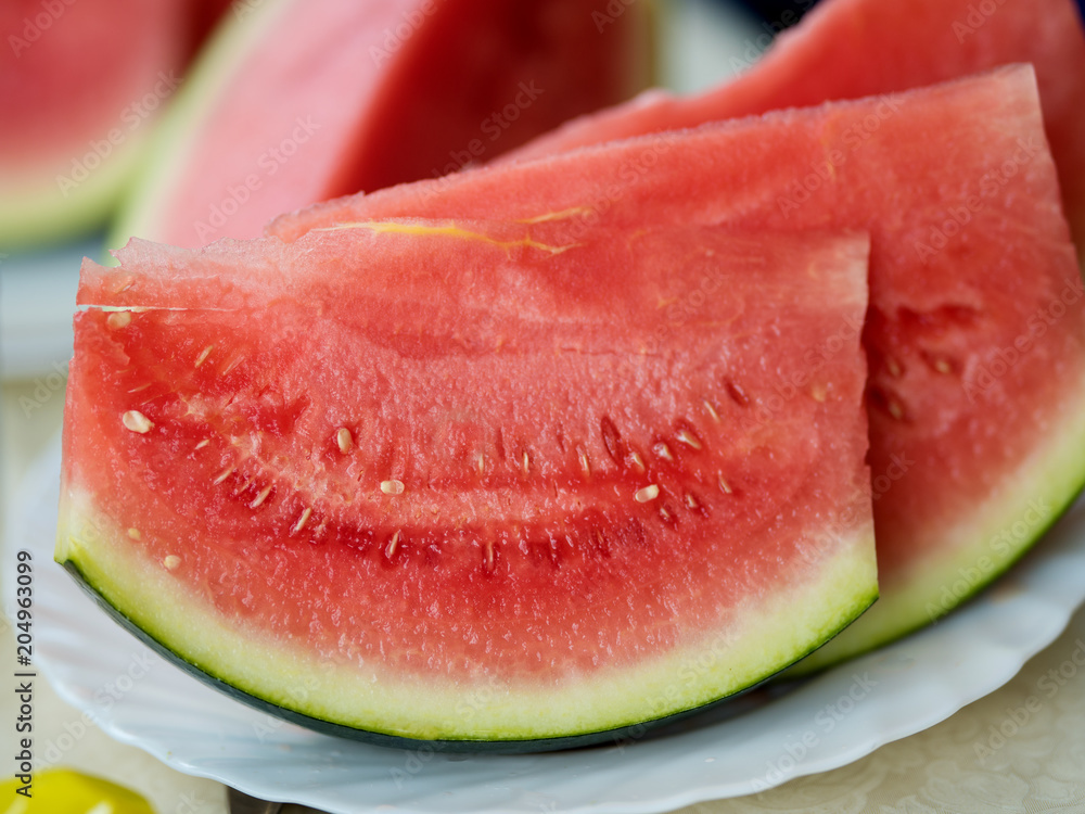 cut slices of watermelon on a plate cut slices of watermelon on a plate