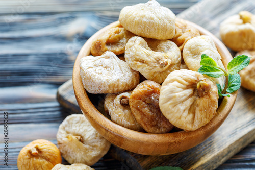 Dried figs in a bowl closeup. photo