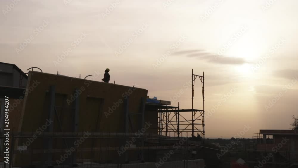 Sunset over building construction, low angle Sunset over building construction, low angle