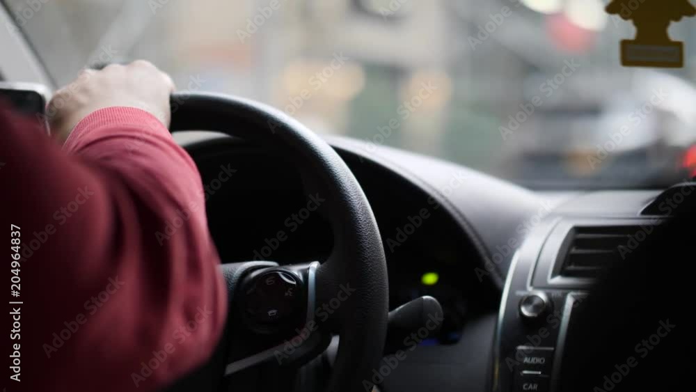 Man driving in his car in the city Man driving in his car in the city