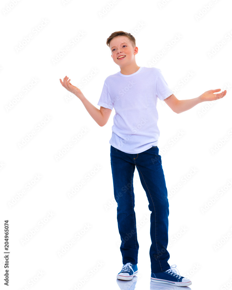 A little boy in a white T-shirt emotionally gestures with his ha A little boy in a white T-shirt emotionally gestures with his ha