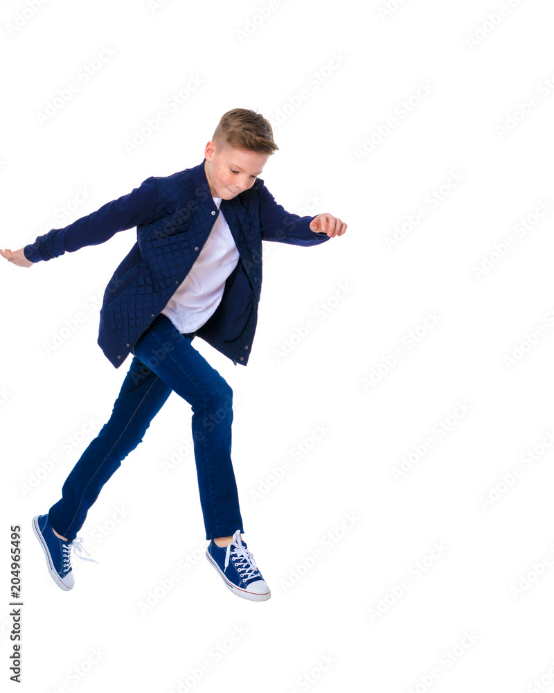 A cheerful little boy from school age is dancing breakdance. A cheerful little boy from school age is dancing breakdance.