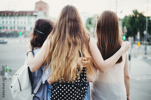 Traveling, sightseeing, city tour, vacation,adventure, holidays, friendship,students exchange program, leisure, hobby Happy young women friends hugging looking at city view