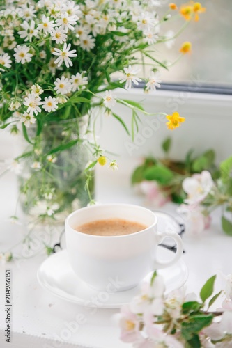 cup of morning coffee with flowers