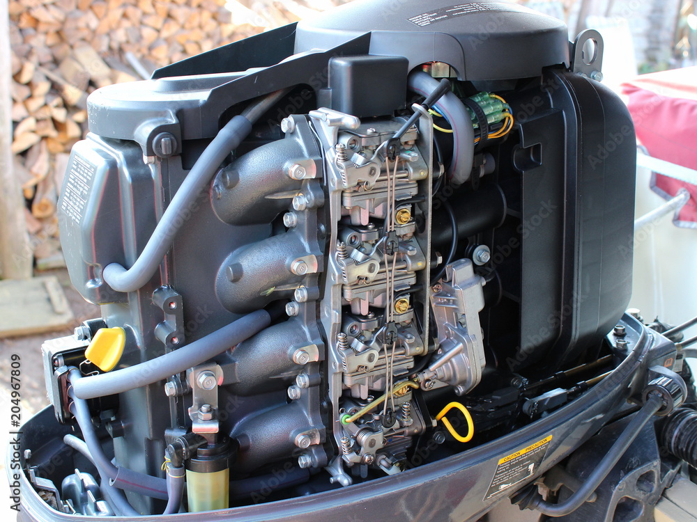 Right side four-stroke outboard motor with four carburetors and oil dipstick