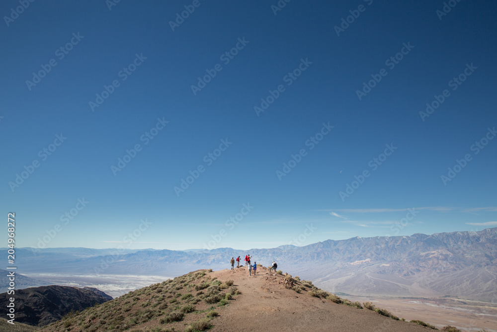 Tourists take in views of Badwater Basin, Death Valley, USA