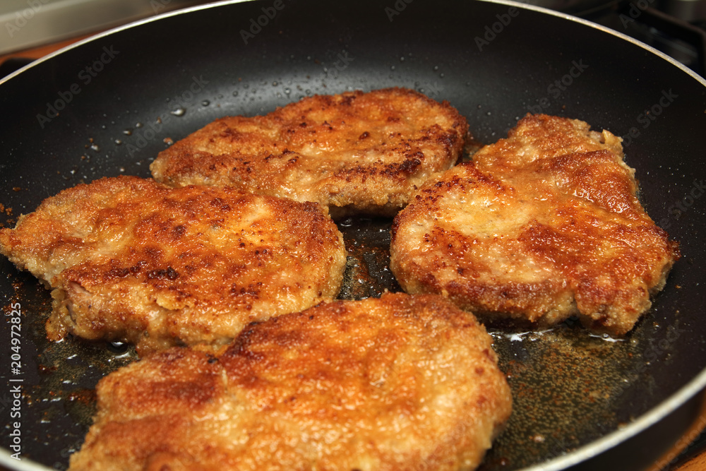 Schnitzel in a pan Schnitzel in a pan