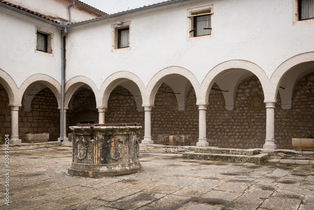 Inner courtyard of church Sveti kriz in Cres