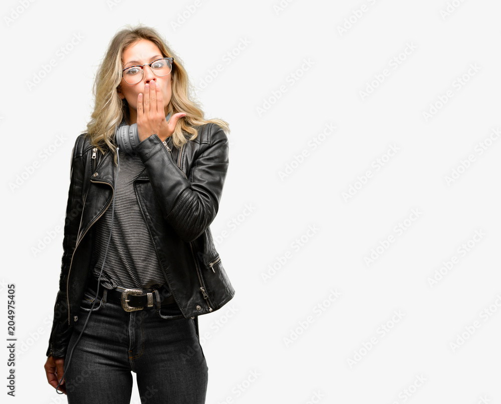 Young student woman with headphones covers mouth in shock, looks shy, expressing silence and mistake concepts, scared Young student woman with headphones covers mouth in shock, looks shy, expressing silence and mistake concepts, scared