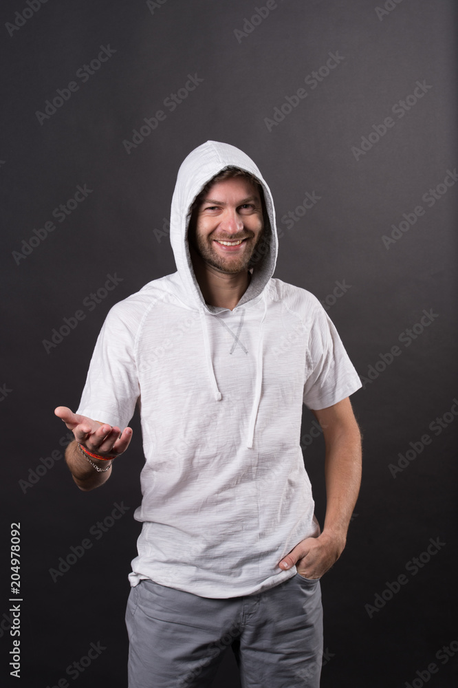 Happy man with beard in hood. Bearded man wear casual sweatshirt. Fashion model smile in hoodie tshirt. Active lifestyle and health activity. Fashion style and trend concept Happy man with beard in hood. Bearded man wear casual sweatshirt. Fashion model smile in hoodie tshirt. Active lifestyle and health activity. Fashion style and trend concept