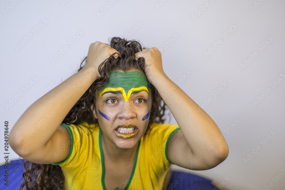 Nervous girl Brazil team nervous with painted face Nervous girl Brazil team nervous with painted face